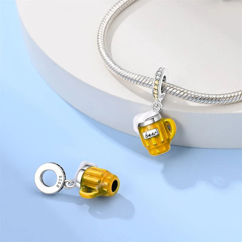sterling silver pandora bracelet with a yellow sparkled beer mug in different views for display