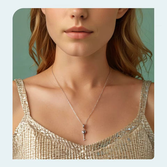 sterling 925 sterling silver Key charm, its in the shape of a heart with small zircon stones.