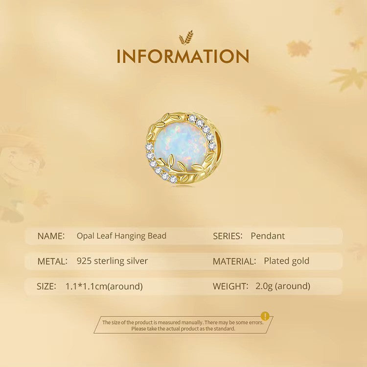 A Sterling 925 silver charm with a gold color finish, featuring an opal wheat leaf design, surrounded by clear zirconia stones. back side is studded leaves. product measurements