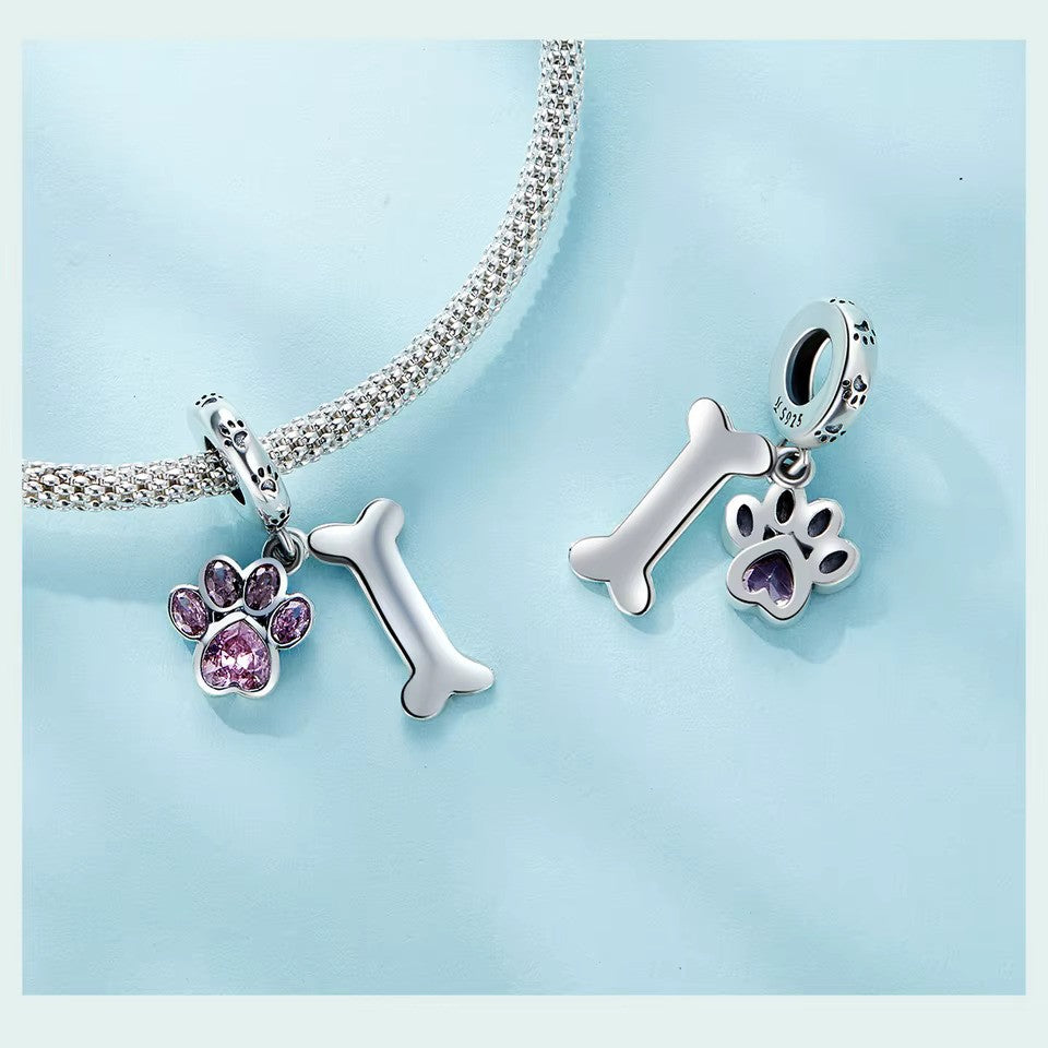 Charm-Anhänger Pfote und Knochen aus Sterlingsilber 925 rosa