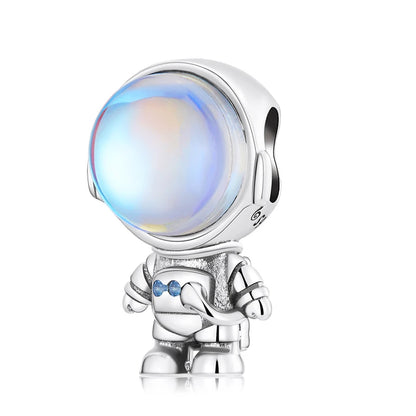Silver charm with a colorful gem on a white background, astronaut charm