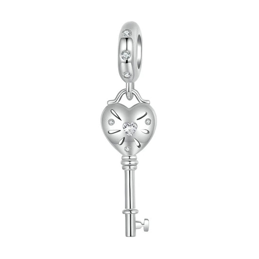 sterling 925 sterling silver Key charm, its in the shape of a heart with small zircon stones.
