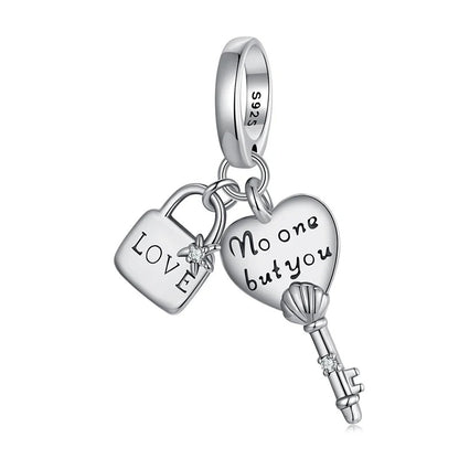 sterling 925 silver charm with a lock engraved with ( love ) and a star with a small zircon stone and a key with heart engraved with ( no one but you ) and the body of the key is shell with a small zircon stone.